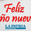 Aviso navideño que dice "Feliz año nuevo" con un logo del periódico LA PATRIA debajo.