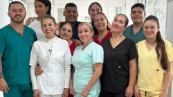 María Aracelly Grisales junto a sus compañeros de trabajo.